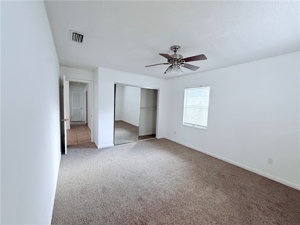 224 Georgia Street Vero Beach, FL 32962 - Photo 12 of 23 a view of a big room with chandelier fan and windows