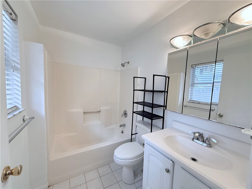224 Georgia Street Vero Beach, FL 32962 - Photo 16 of 23 a bathroom with a sink toilet and shower