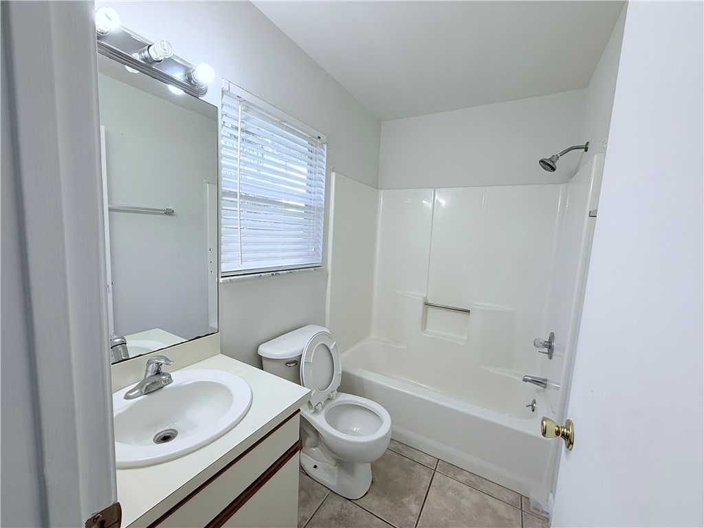 224 Georgia Street Vero Beach, FL 32962 - Photo 17 of 23 a bathroom with a sink toilet and shower
