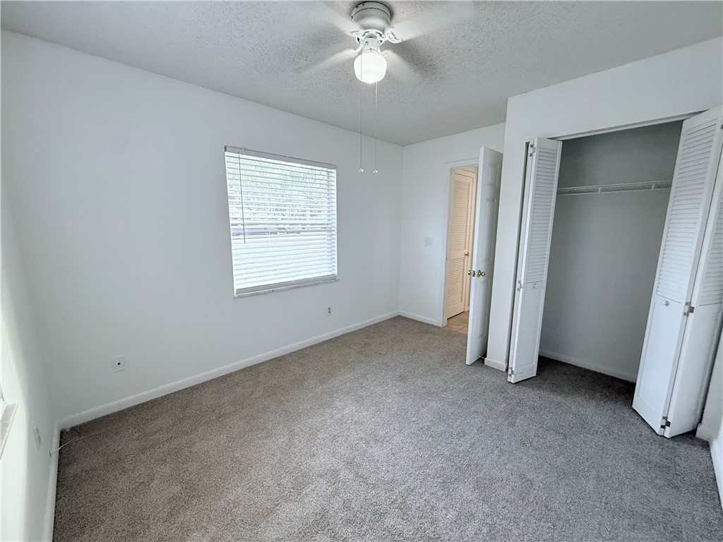 224 Georgia Street Vero Beach, FL 32962 - Photo 19 of 23 a view of a livingroom with a ceiling fan and window