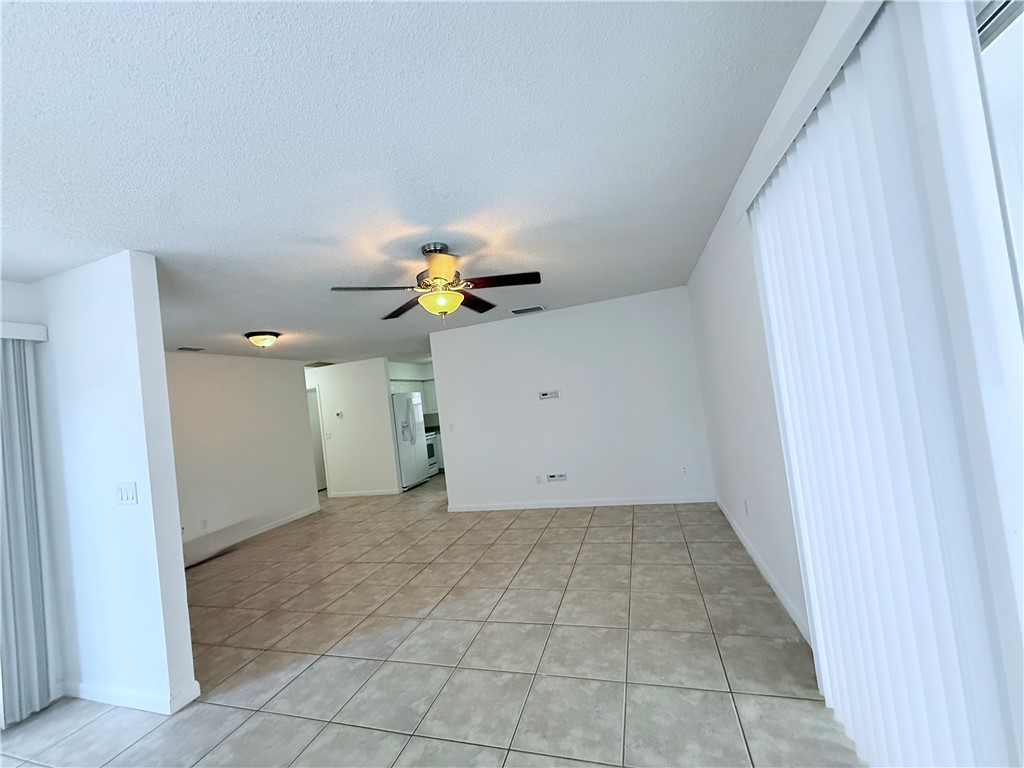 224 Georgia Street Vero Beach, FL 32962 - Photo 6 of 23 a view of a hallway with a chandelier