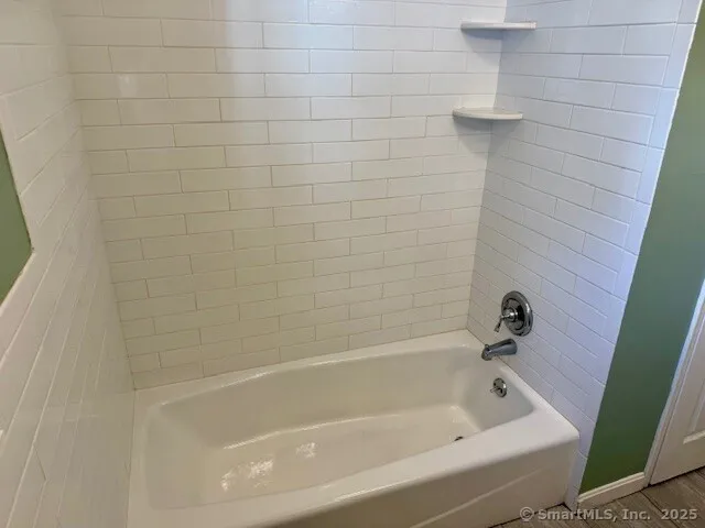 a close up of a bathtub in a bathroom