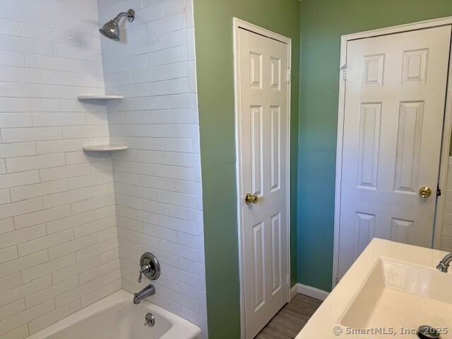 498 Oak Avenue, Unit 28 Cheshire, CT 06410 - Photo 14 of 21 a bathroom with a tub and shower