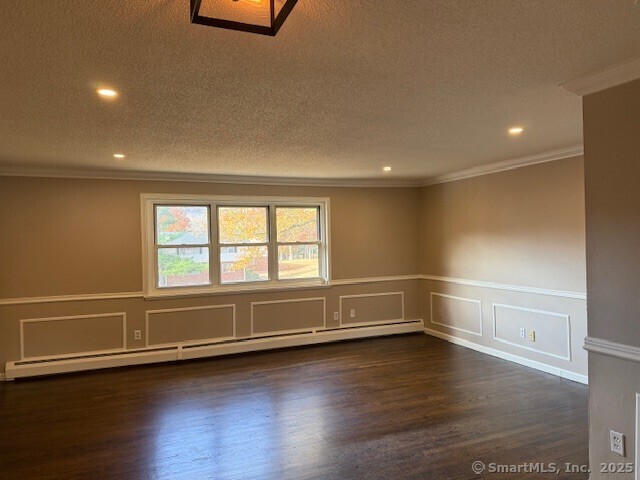 498 Oak Avenue, Unit 28 Cheshire, CT 06410 - Photo 8 of 21 a view of an empty room with wooden floor and a window