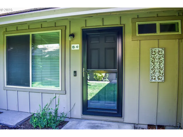 a view of a door and front of a house
