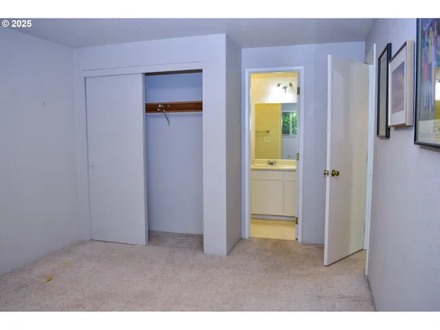 a view of an empty room with a bathroom