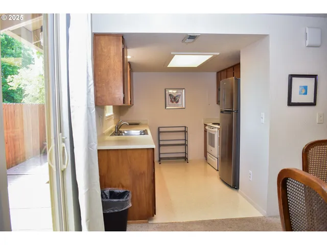 a view of living room with furniture and a window