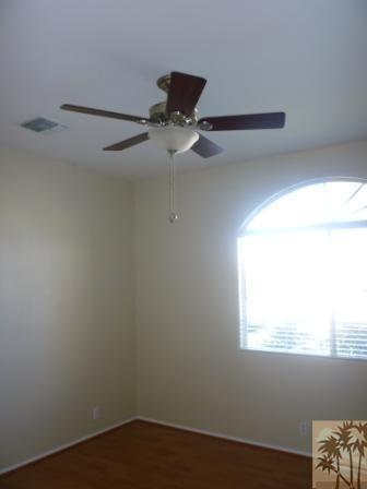 68433 Riviera Road Cathedral City, CA 92234 - Photo 12 of 21 a view of a small space with wooden floor and a window