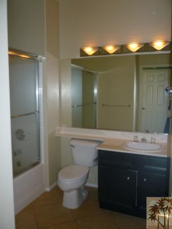68433 Riviera Road Cathedral City, CA 92234 - Photo 13 of 21 a bathroom with a sink and mirror