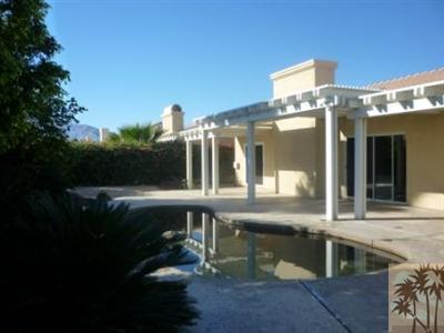 68433 Riviera Road Cathedral City, CA 92234 - Photo 17 of 21 a front view of a house with a yard