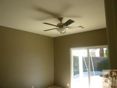68433 Riviera Road Cathedral City, CA 92234 - Photo 8 of 21 a view of a livingroom with a ceiling fan