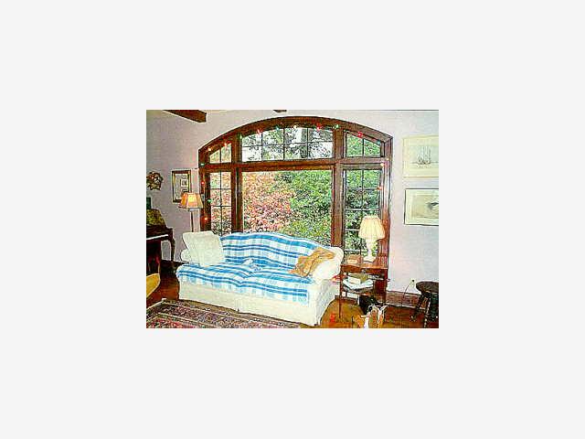 10080 Alba Road Ben Lomond, CA 95005 - Photo 2 of 5 a view of a living room with a floor to ceiling window