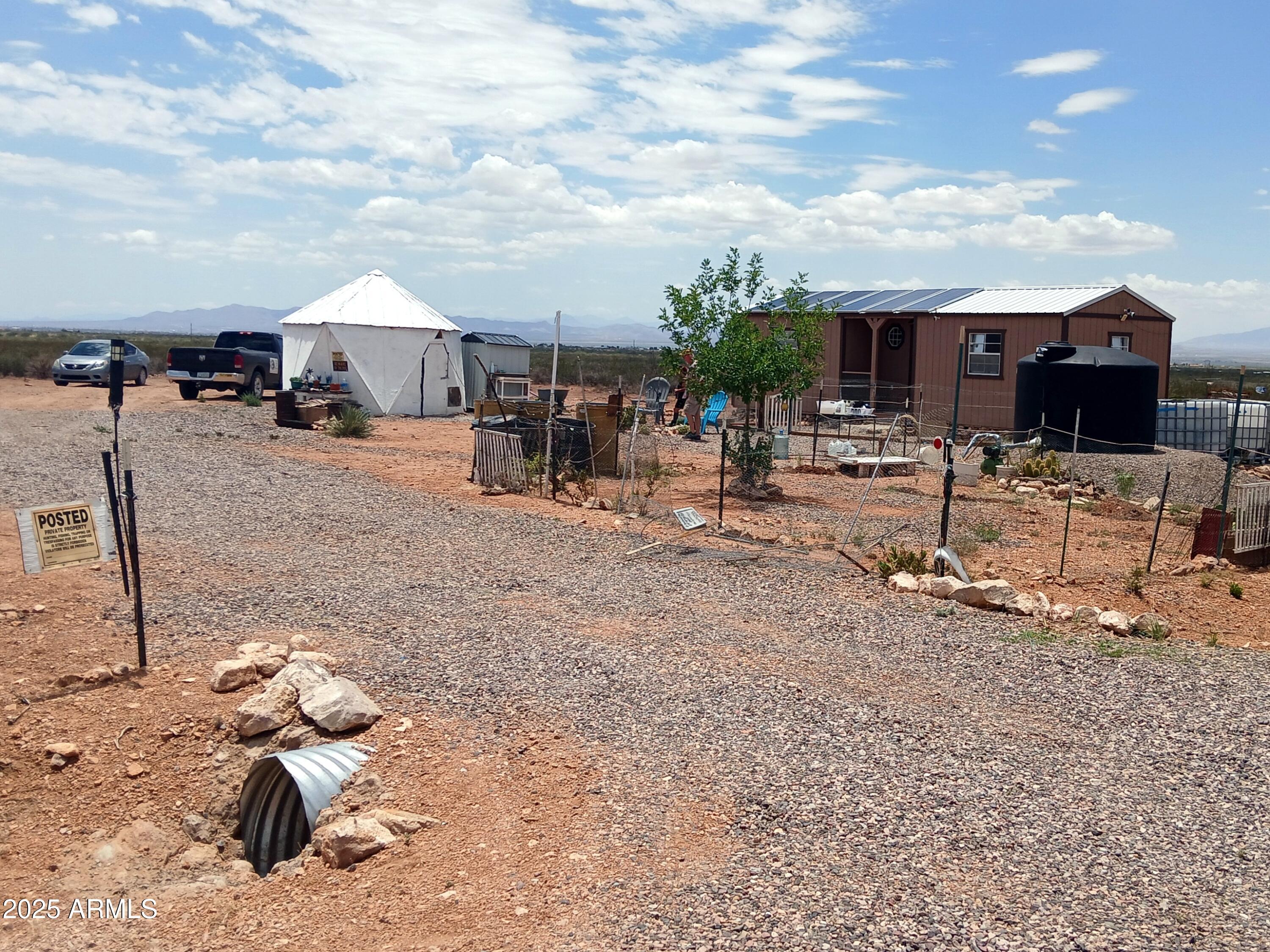 a view of a backyard with furniture