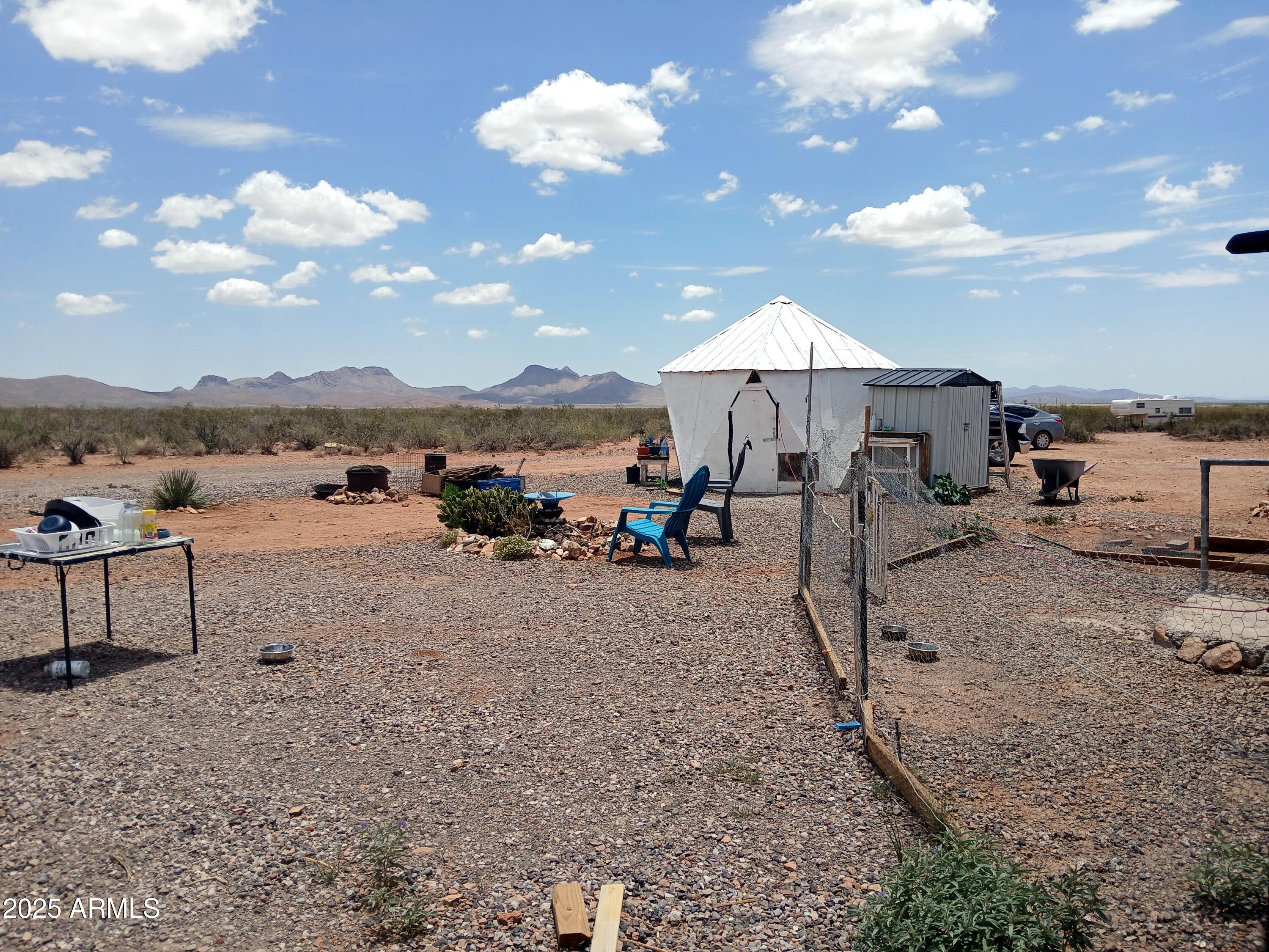 3283 C. Los Vientos Douglas, AZ 85607 - Photo 14 of 20 a view of a lake with a mountain