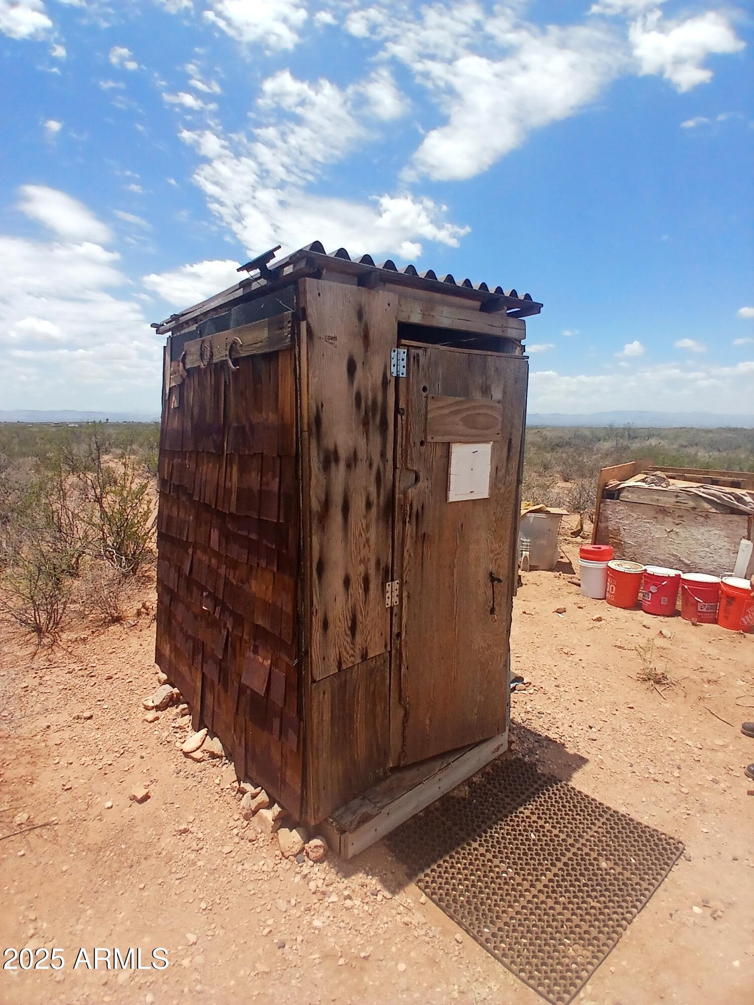 3283 C. Los Vientos Douglas, AZ 85607 - Photo 16 of 20 a view of a house with wooden fence
