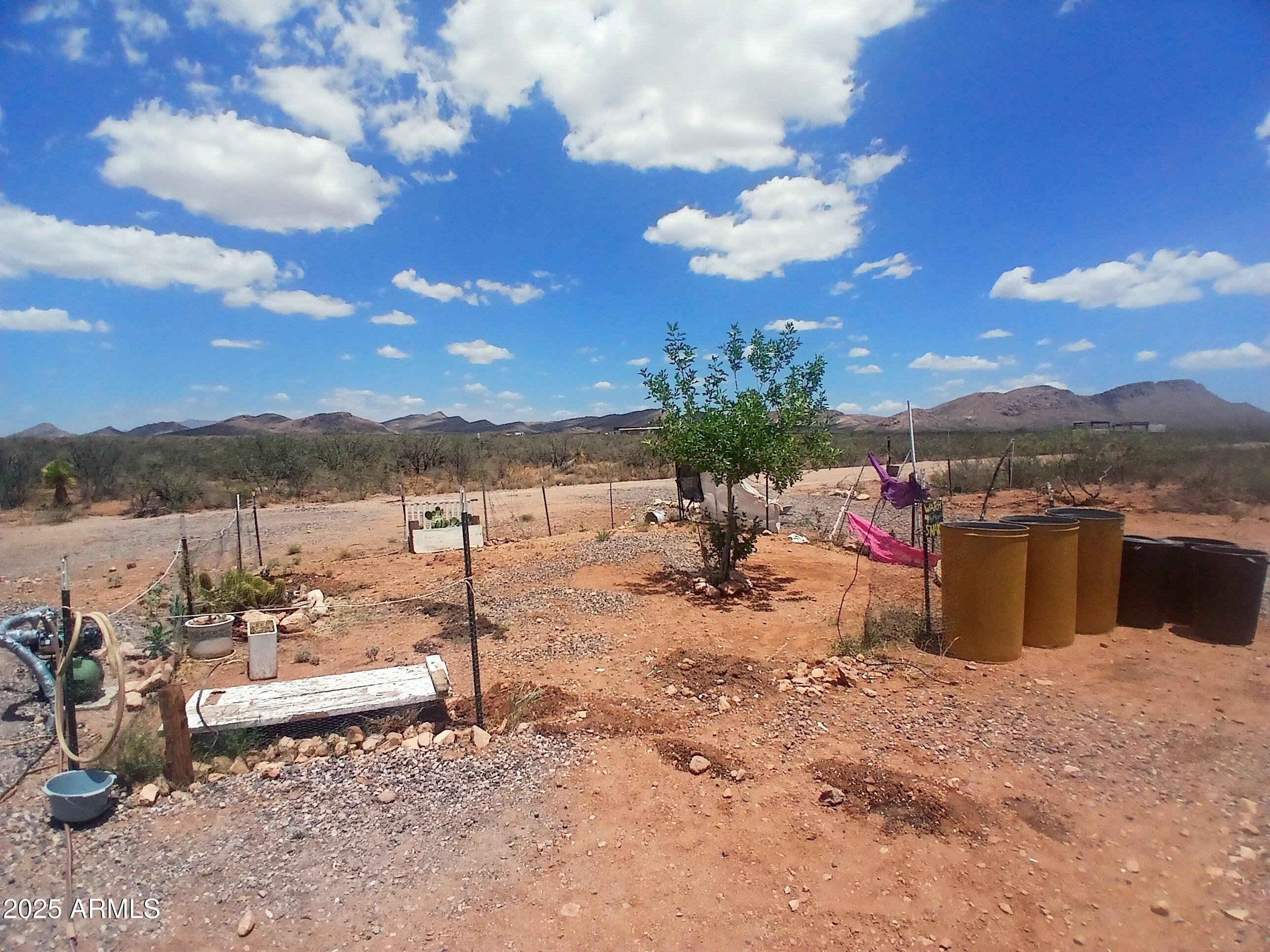3283 C. Los Vientos Douglas, AZ 85607 - Photo 4 of 20 a view of a terrace with a bench