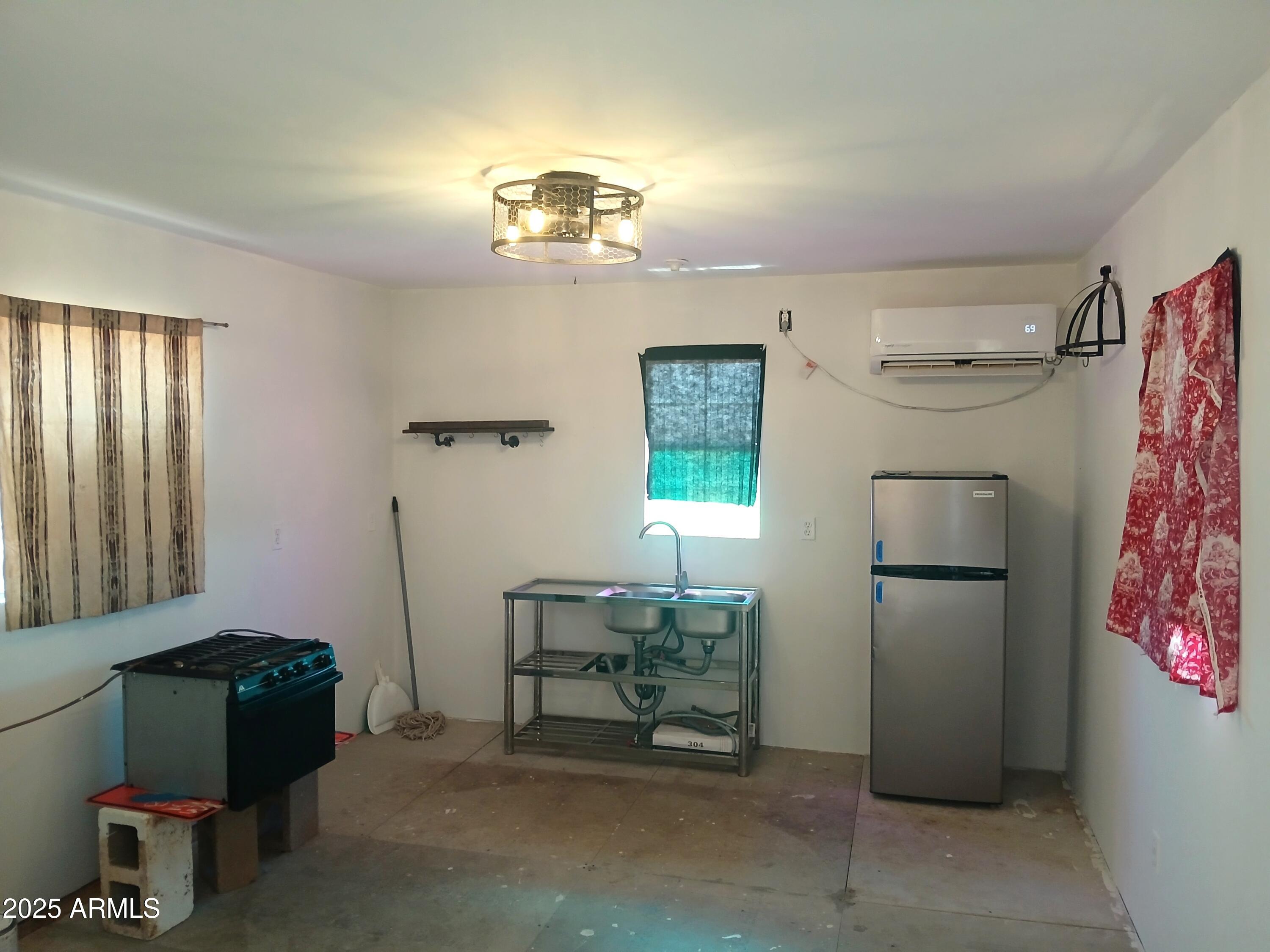 3283 C. Los Vientos Douglas, AZ 85607 - Photo 5 of 20 a room with furniture and a window