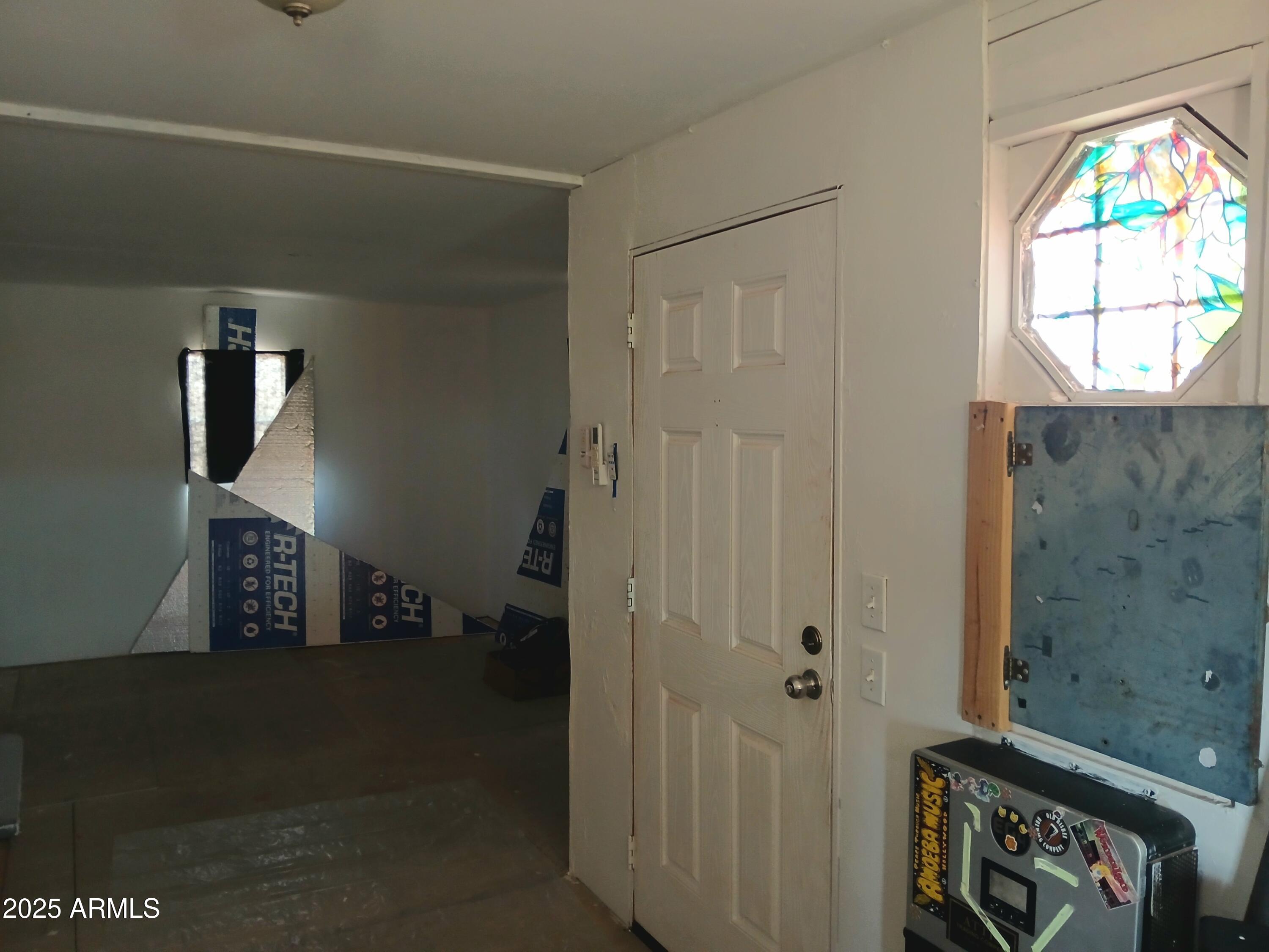3283 C. Los Vientos Douglas, AZ 85607 - Photo 9 of 20 a view of an entryway with wooden floor
