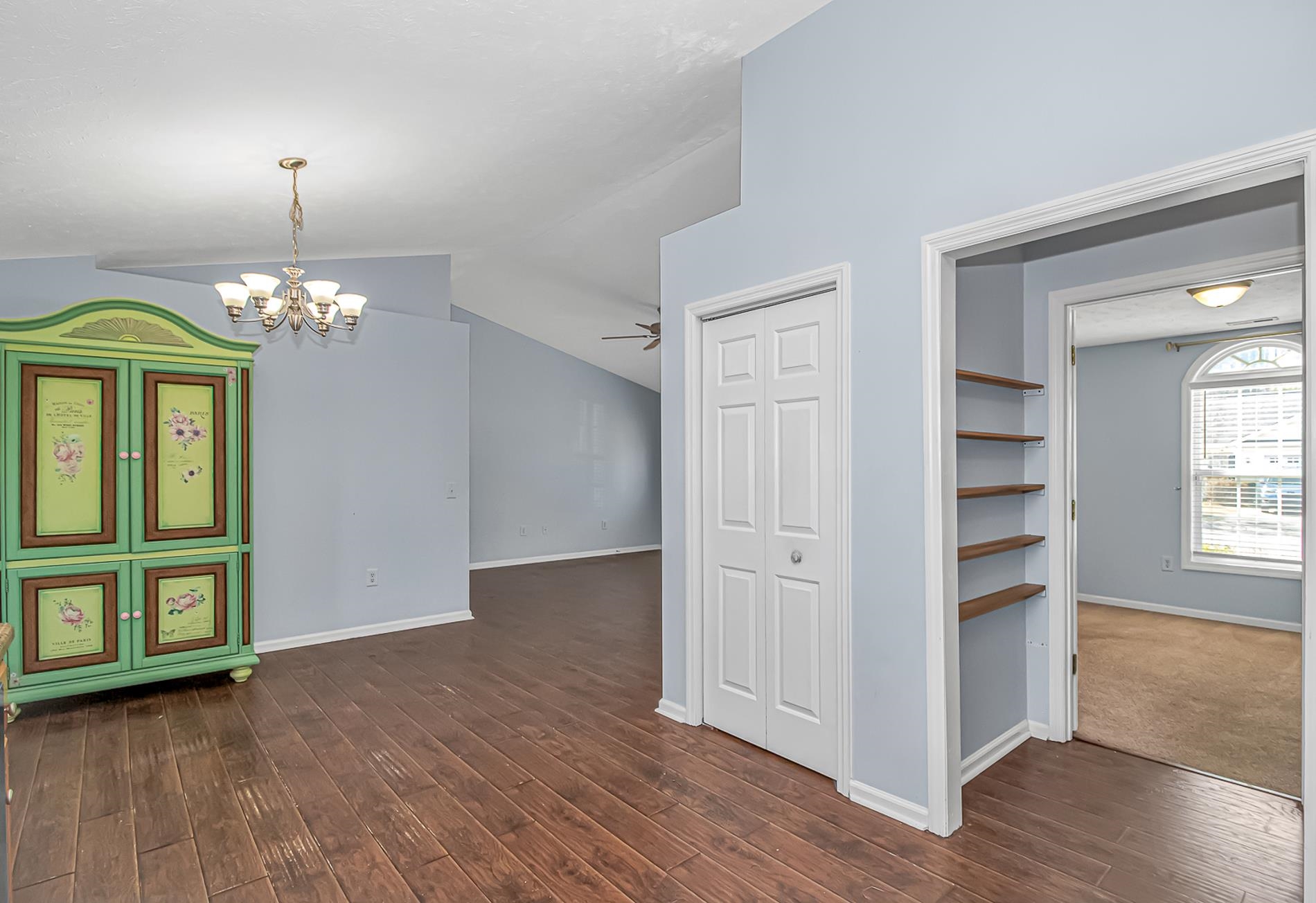 1012 Cadbury Court Conway, SC 29527 - Photo 14 of 40 Unfurnished dining area featuring a chandelier, lofted ceiling, dark wood-style flooring, and ceiling fan