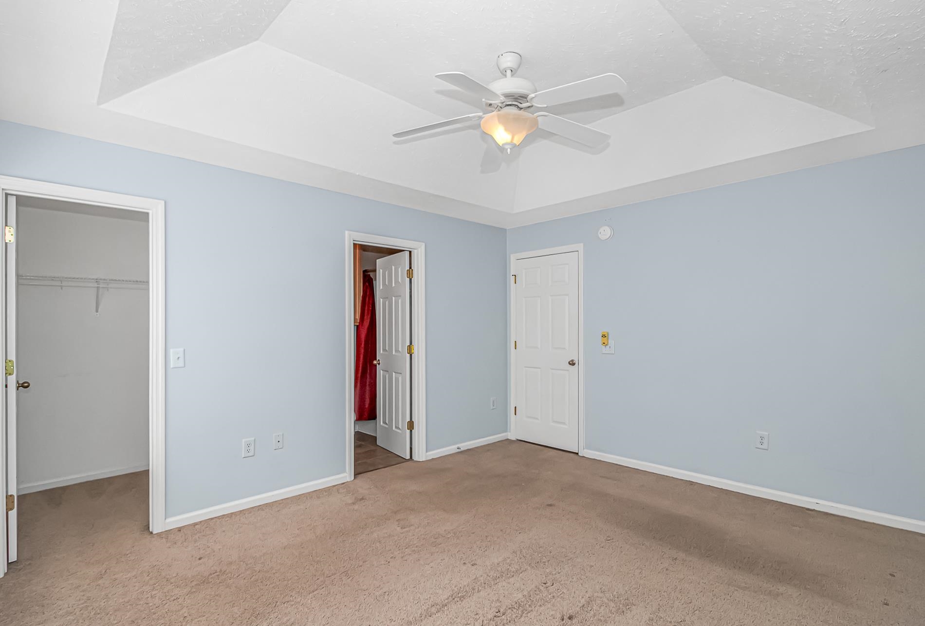 1012 Cadbury Court Conway, SC 29527 - Photo 28 of 40 Unfurnished bedroom with a raised ceiling, a spacious closet, carpet flooring, ceiling fan, and a textured ceiling