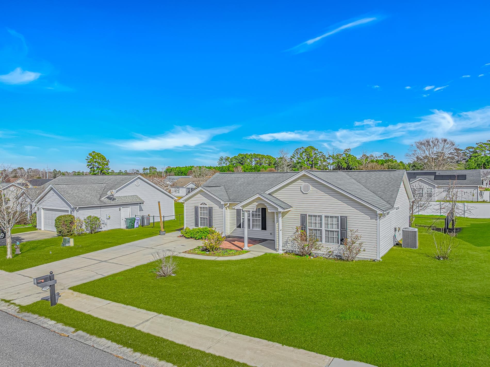 1012 Cadbury Court Conway, SC 29527 - Photo 3 of 40 View of front of home featuring a front yard, roof with shingles, and driveway