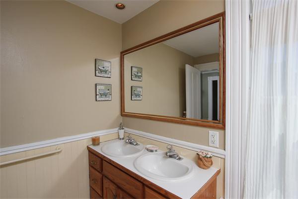 18 Walnut Road Hamilton, MA 01982 - Photo 12 of 14 a bathroom with a sink vanity and mirror