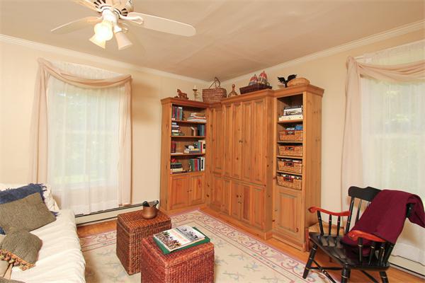 18 Walnut Road Hamilton, MA 01982 - Photo 7 of 14 a living room with furniture a ceiling fan and a window