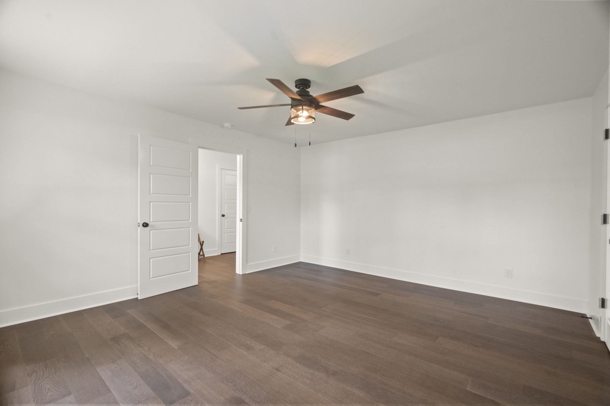 5670 Lakeview Road Springfield, TN 37172 - Photo 15 of 50 an empty room with wooden floor and fan