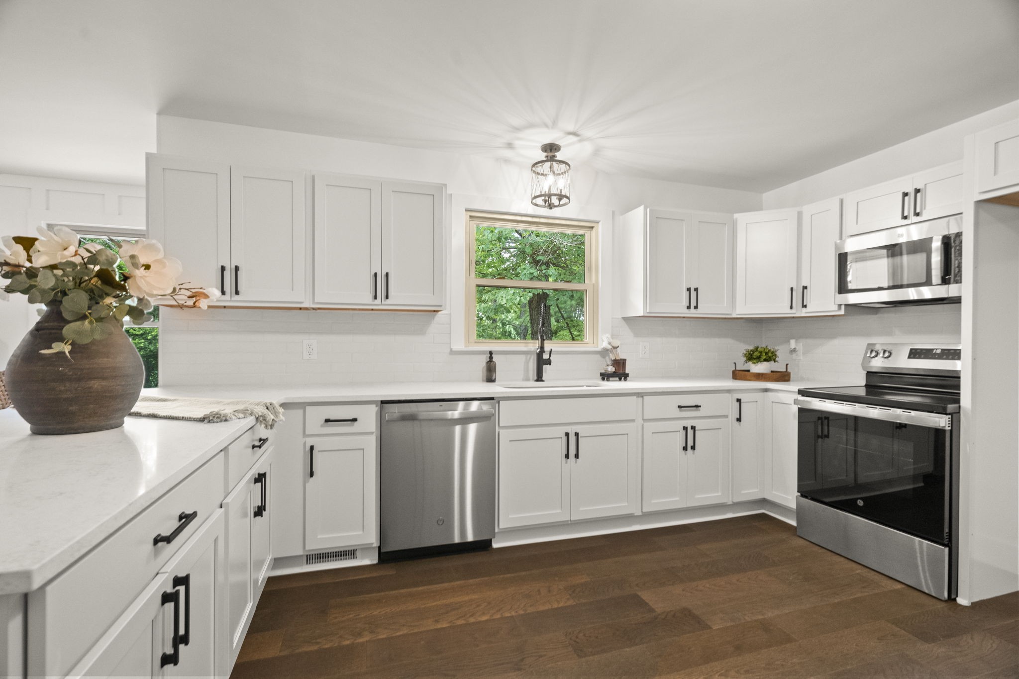 5670 Lakeview Road Springfield, TN 37172 - Photo 24 of 50 a kitchen with granite countertop white cabinets white stainless steel appliances with a sink and dishwasher