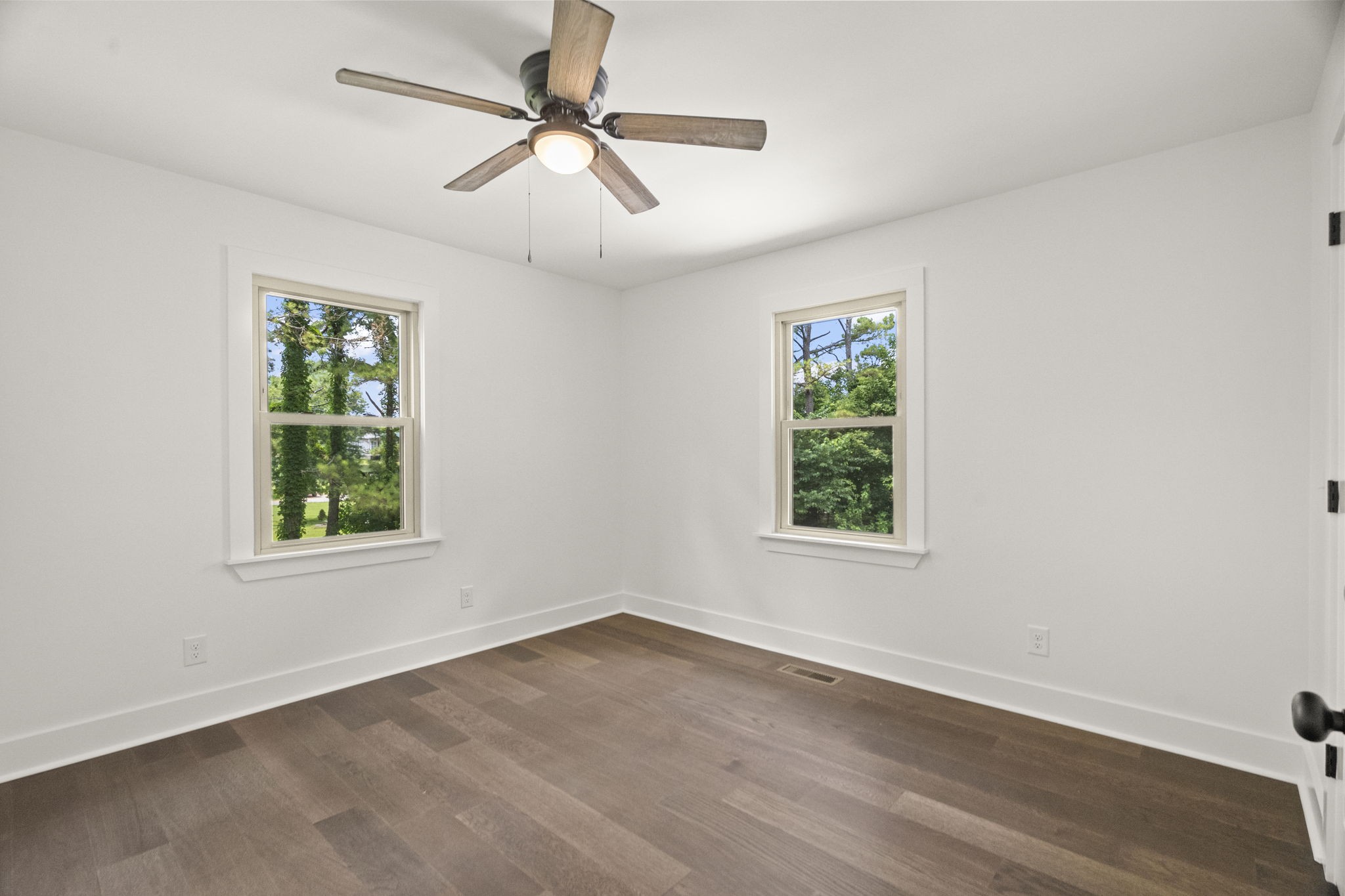 5670 Lakeview Road Springfield, TN 37172 - Photo 33 of 50 an empty room with wooden floor chandelier fan and windows