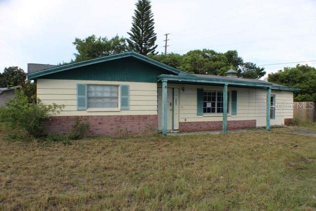 3651 Moog Road Holiday, FL 34691 - Photo 1 of 1 a house with trees in the background