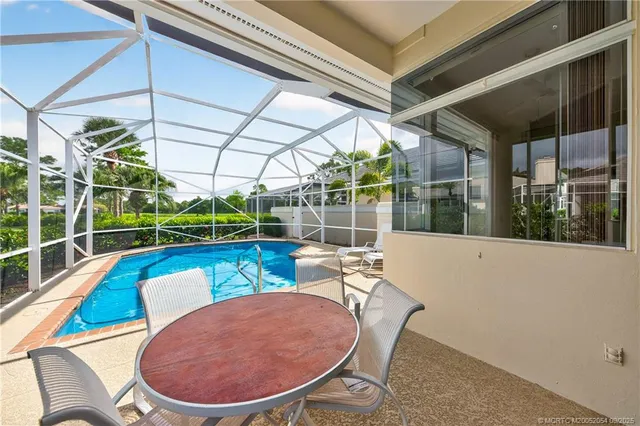 a view of a swimming pool with a patio