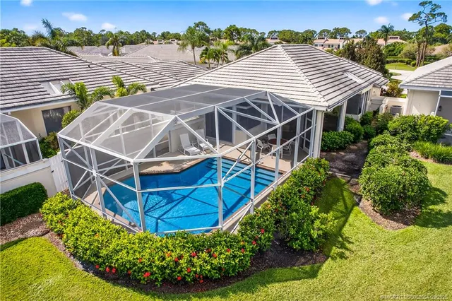 an aerial view of a house with swimming pool
