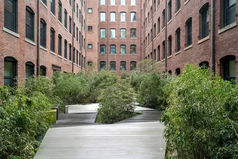 a view of a building with a garden