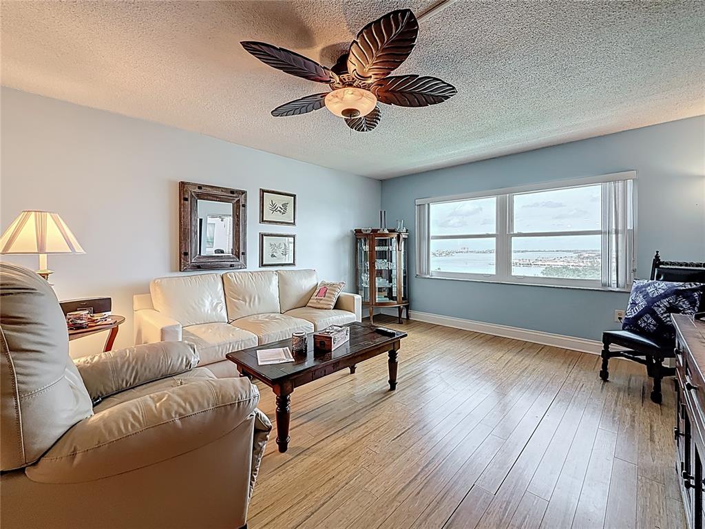 4725 Cove Circle, Unit 908 St. Petersburg, FL 33708 - Photo 20 of 61 a living room with furniture and a window