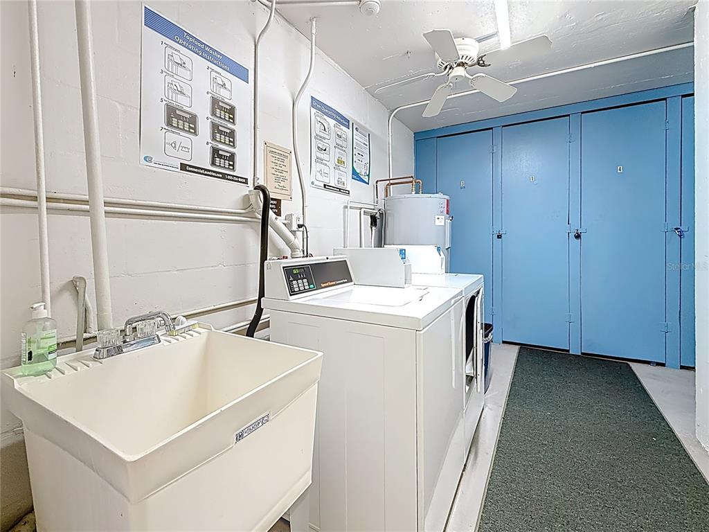 4725 Cove Circle, Unit 908 St. Petersburg, FL 33708 - Photo 32 of 61 a utility room with dryer and washer