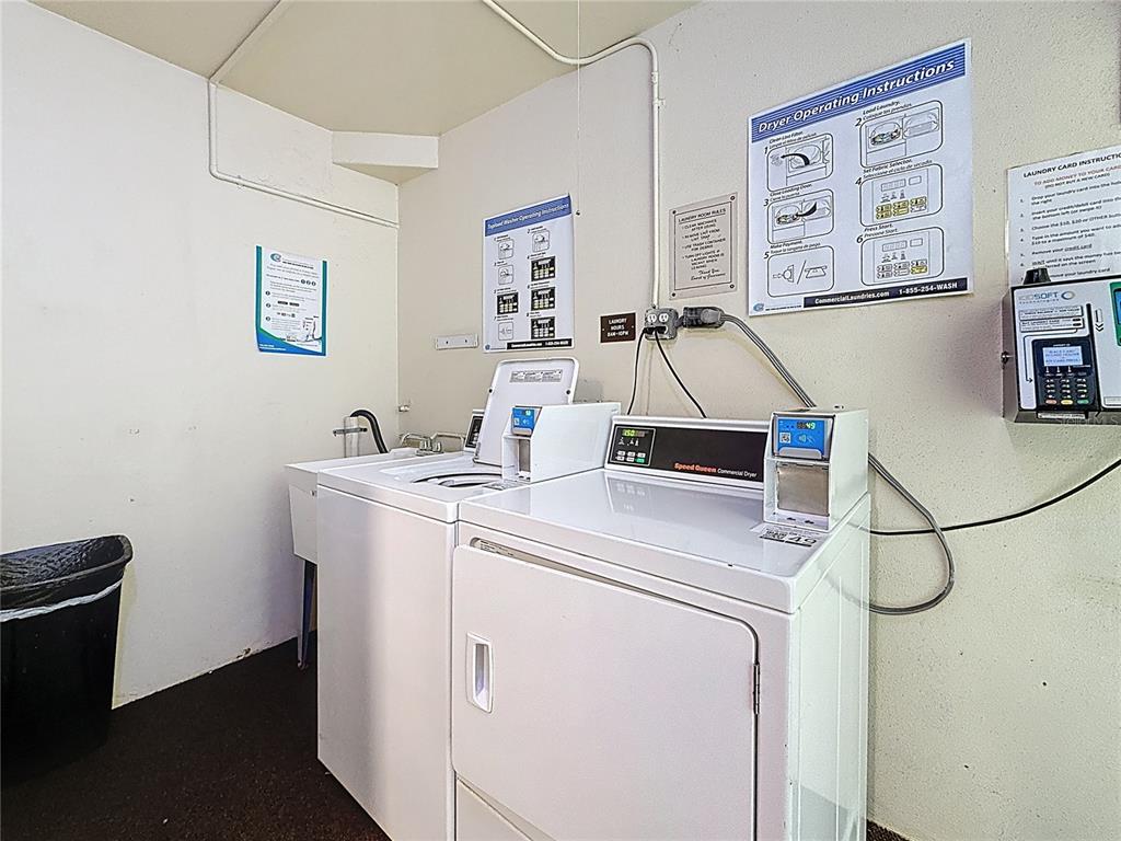 4725 Cove Circle, Unit 908 St. Petersburg, FL 33708 - Photo 33 of 61 a utility room with dryer and washer