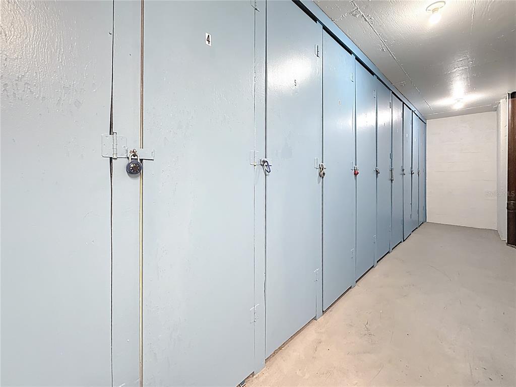 4725 Cove Circle, Unit 908 St. Petersburg, FL 33708 - Photo 34 of 61 a view of a hallway with a elevator
