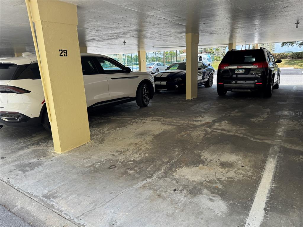 4725 Cove Circle, Unit 908 St. Petersburg, FL 33708 - Photo 36 of 61 a view of car parked in parking