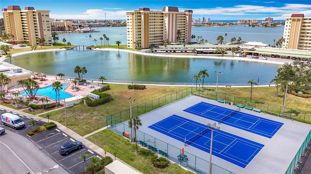 4725 Cove Circle, Unit 908 St. Petersburg, FL 33708 - Photo 40 of 61 a view of a lake with a ocean view