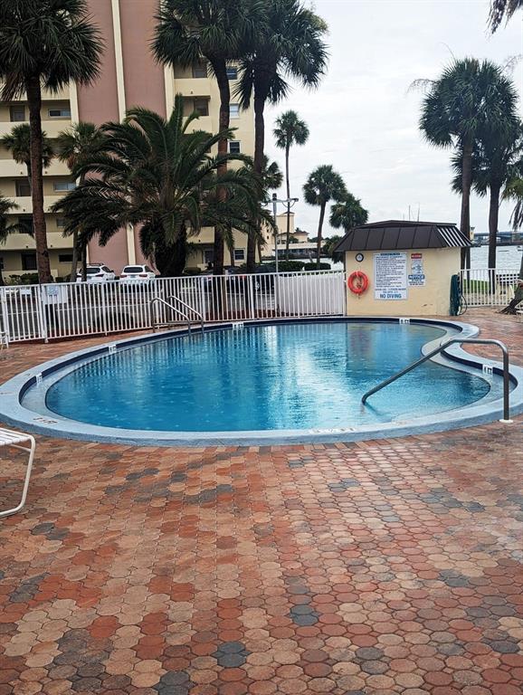4725 Cove Circle, Unit 908 St. Petersburg, FL 33708 - Photo 51 of 61 swimming pool view with a garden space