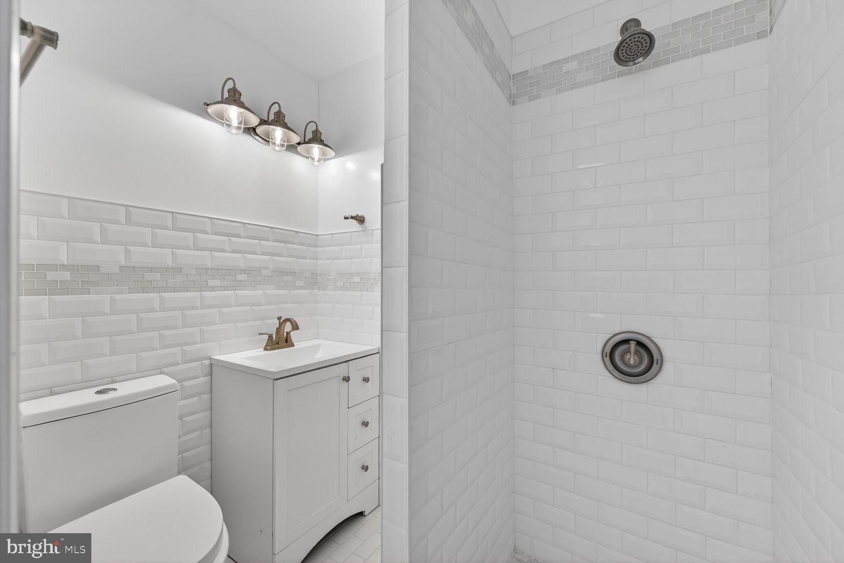 7205 Livingston Road Oxon Hill, MD 20745 - Photo 14 of 25 Sleek, modern bathroom retreat.