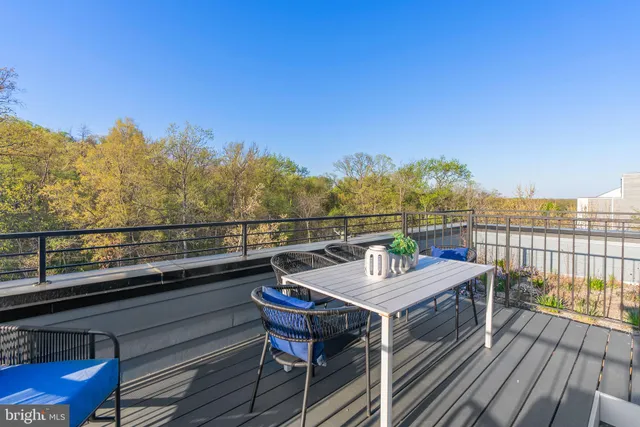 a view of a balcony with wooden floor and city view