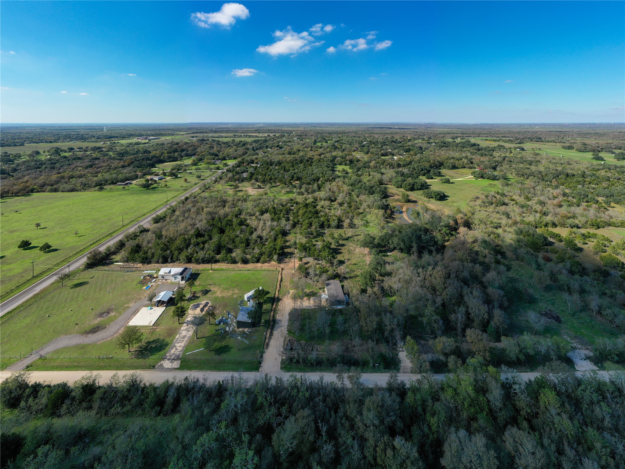 105 Crooked Road Dale, TX 78616 - Photo 5 of 11 an aerial view of a city with lots of residential buildings