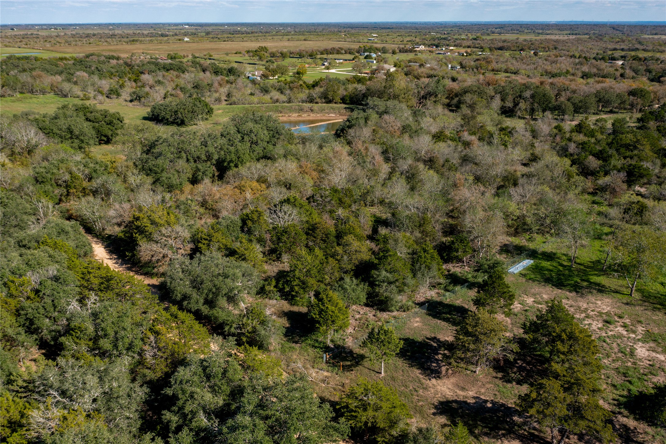 105 Crooked Road Dale, TX 78616 - Photo 8 of 11 a view of a field with a forest