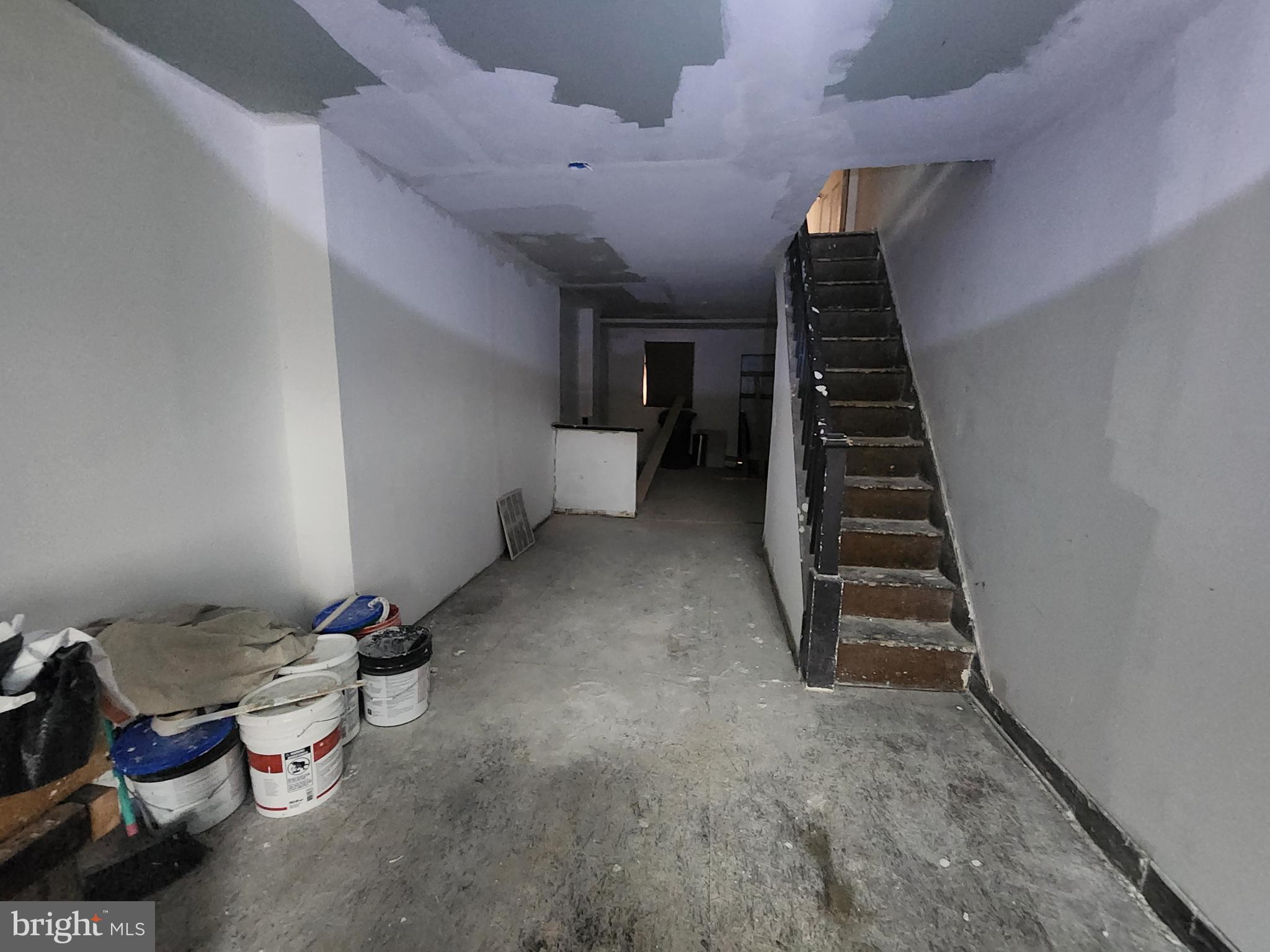 409 South Pulaski Street Baltimore, MD 21223 - Photo 3 of 9 a view of a storage & utility room with two washing machine