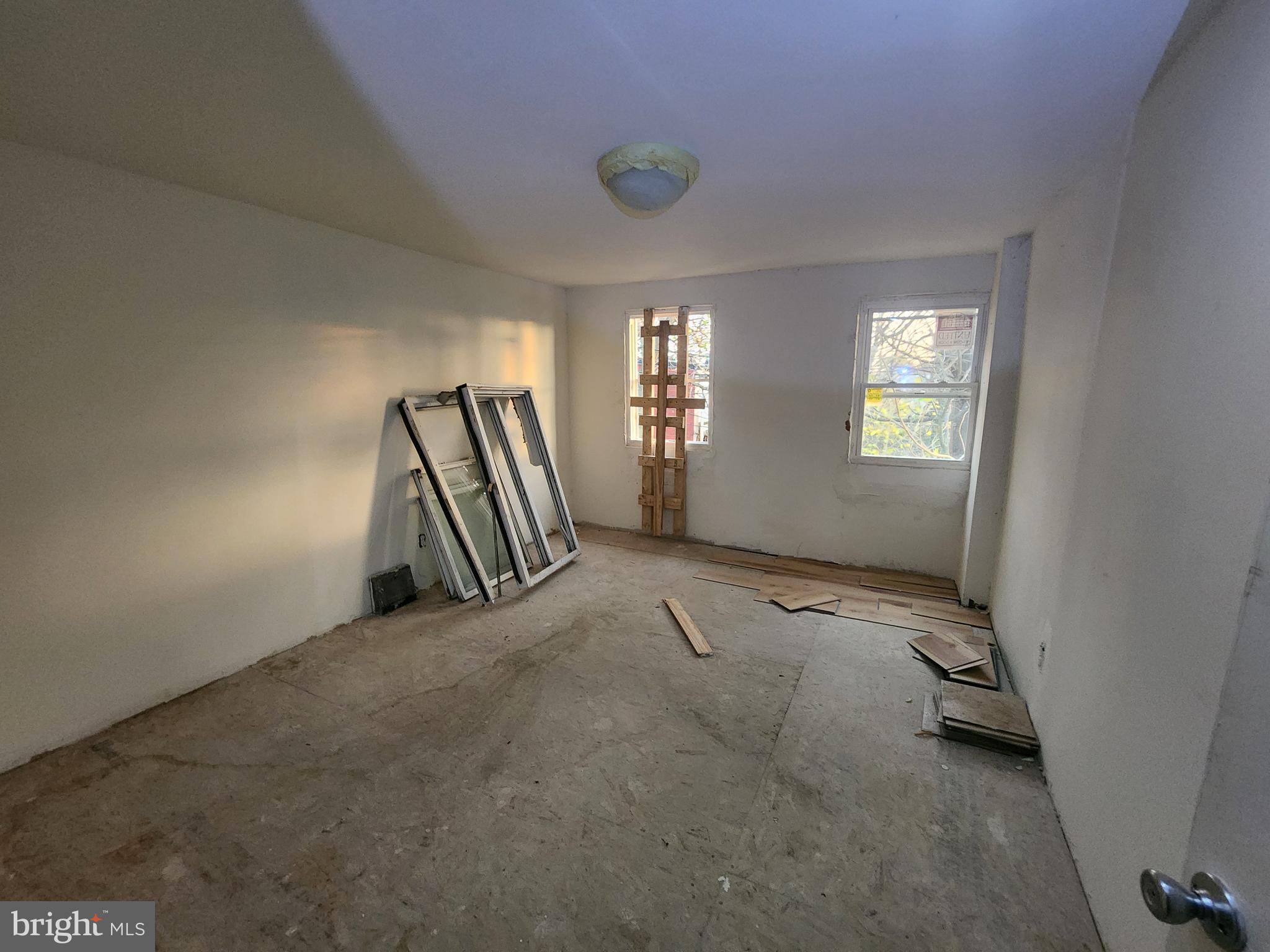 409 South Pulaski Street Baltimore, MD 21223 - Photo 6 of 9 a view of an empty room and a window