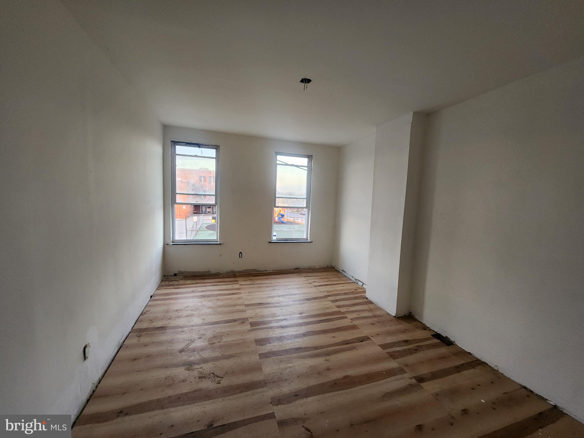 409 South Pulaski Street Baltimore, MD 21223 - Photo 8 of 9 a view of an empty room and window