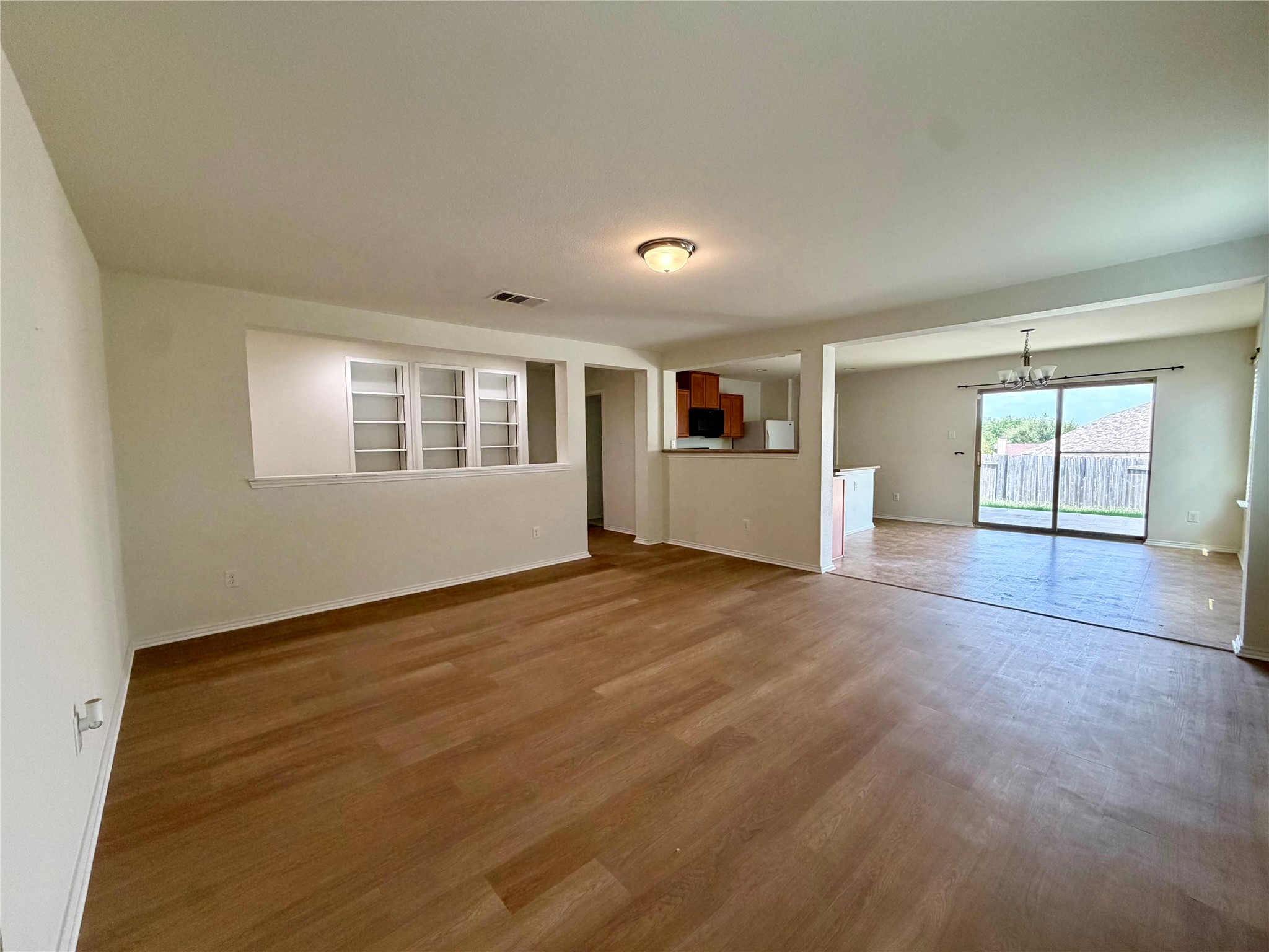 1141 Renaissance Trail Round Rock, TX 78665 - Photo 24 of 24 An open floorplan seamlessly connects the living space to dining and kitchen areas, ideal for entertaining.