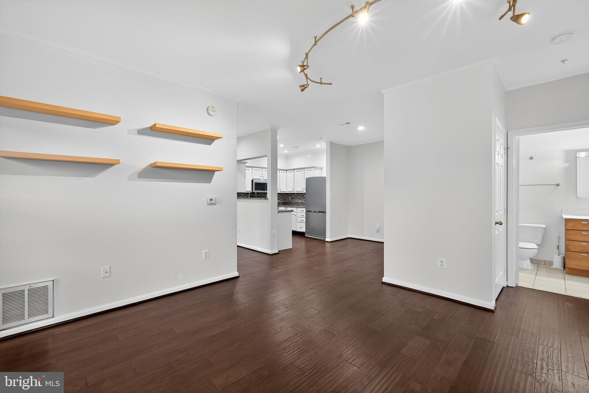 12016 Taliesin Place, Unit 26 Reston, VA 20190 - Photo 11 of 30 a view of a kitchen with a sink and a refrigerator